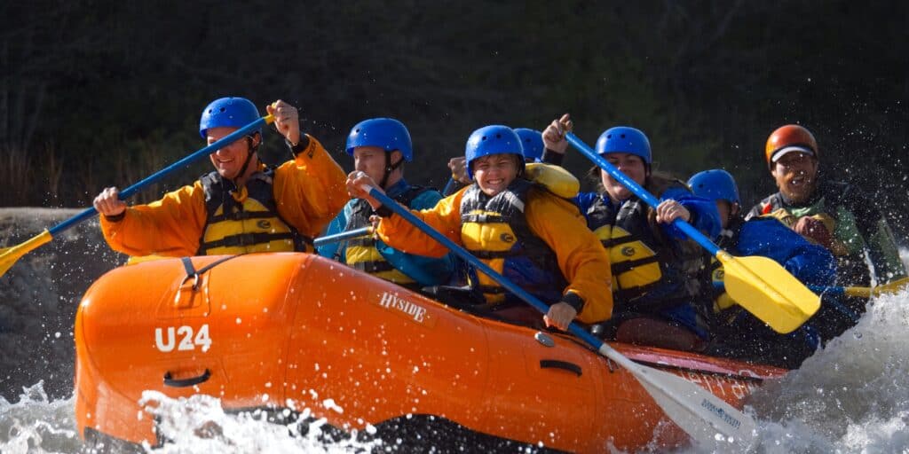 group of people rafting a rapid with Sierra South Mountain Sports Kern River California
