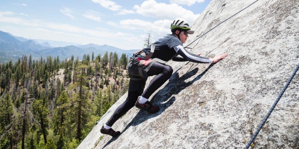 male rock climber navigates the mountain Sierra South Mountain Sports Kern River California