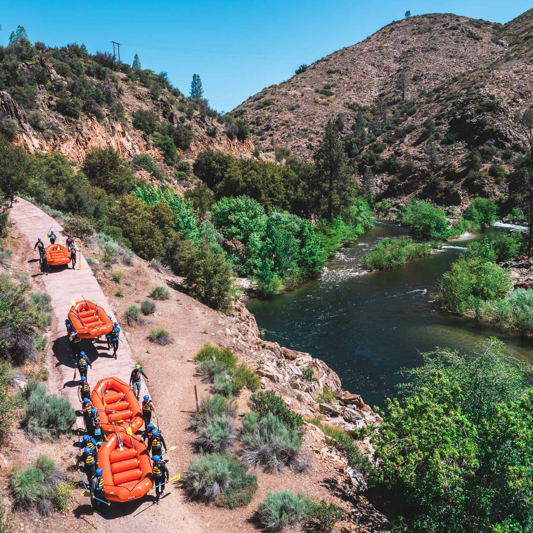 group carrying the rafts to the kern river to start their trip