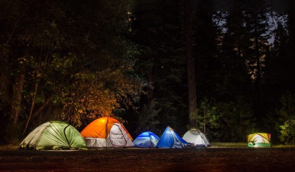 camping tents lit up inside at night Sierra South Mountain Sports Kern River California